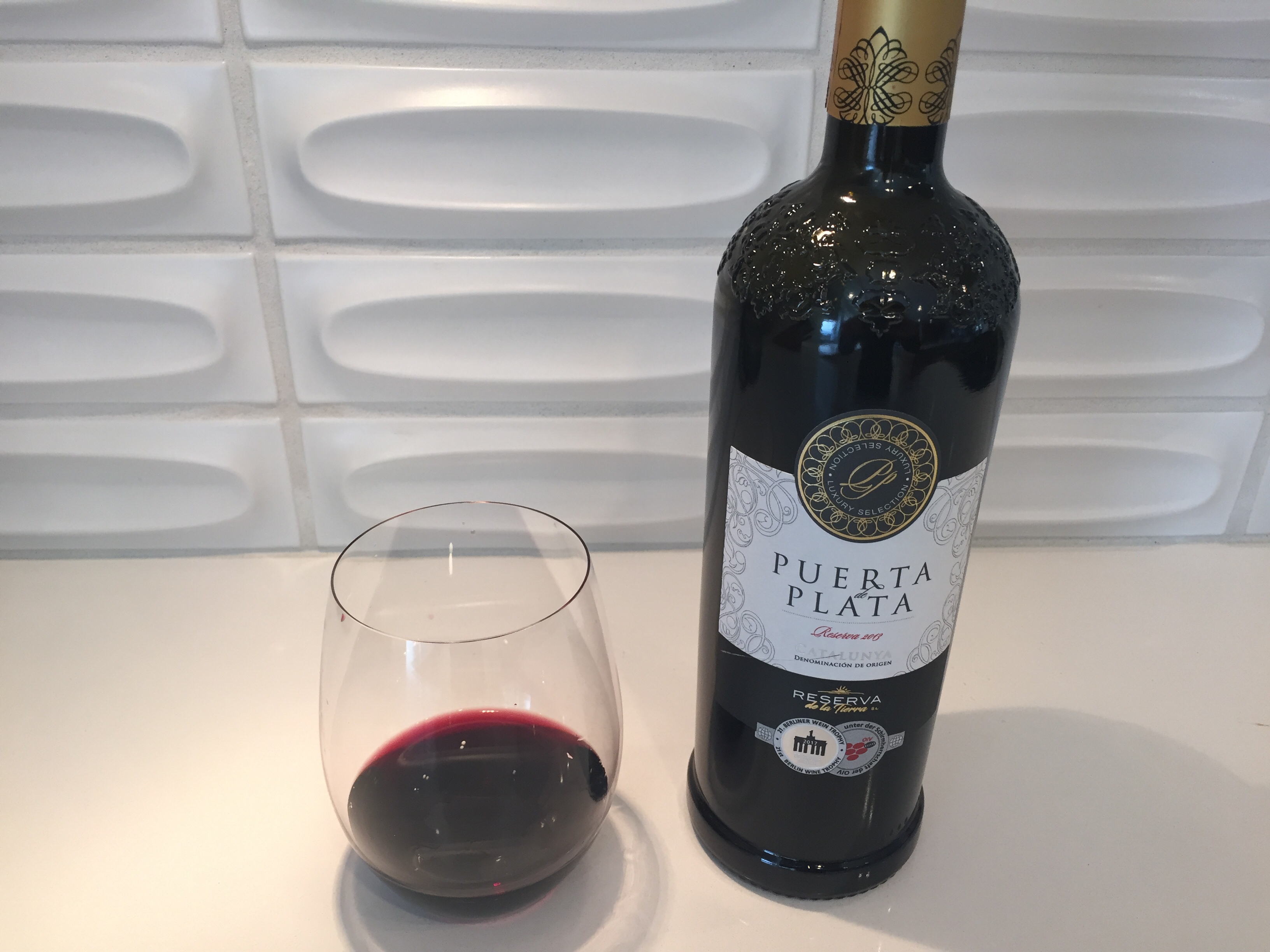 Glass and bottle of 2013 Puerta de Plata from Trader Joe's