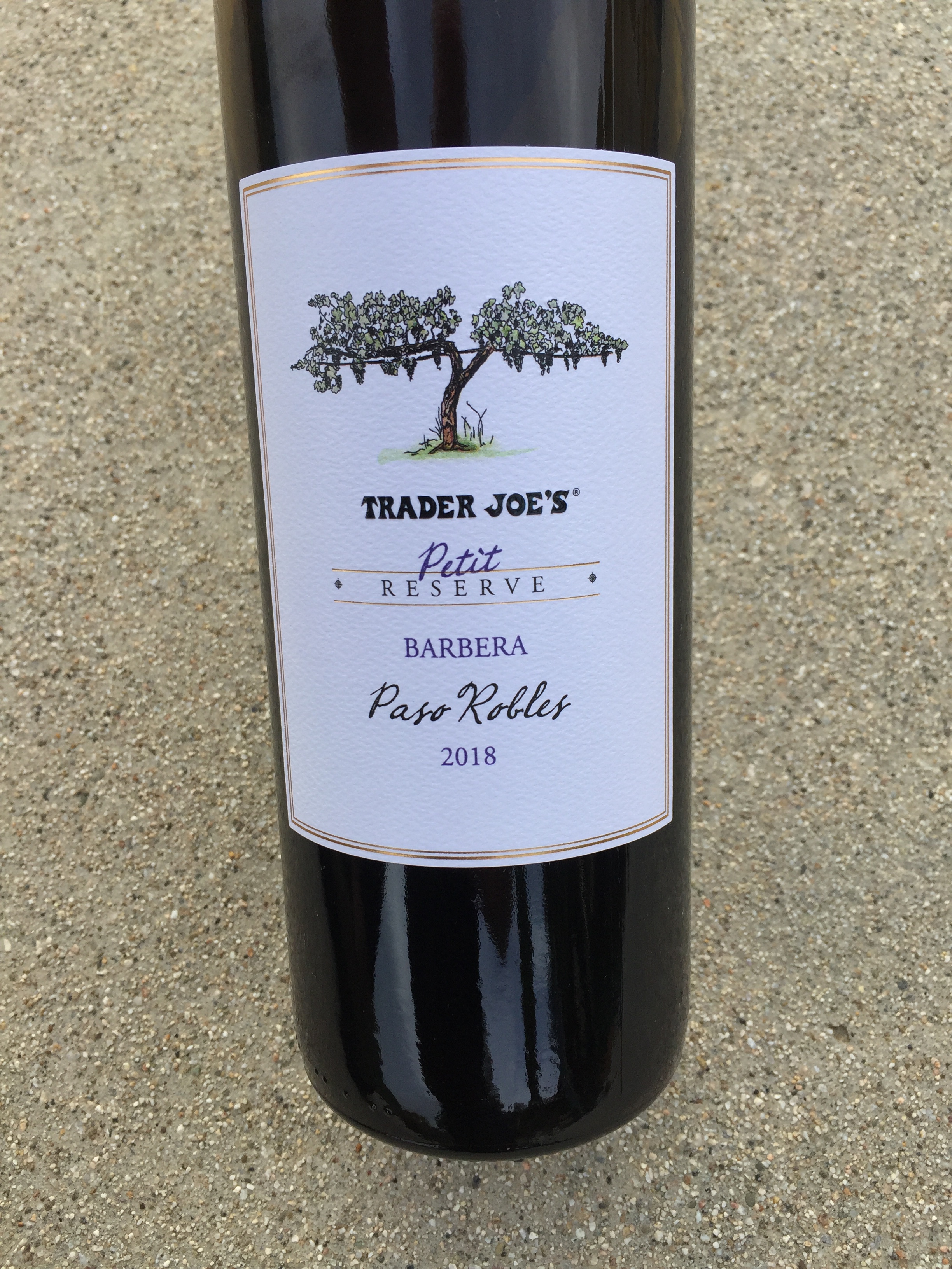 Close up photo of the front label of Trader Joe's Petit Reserve Barbera 2018 Paso Robles