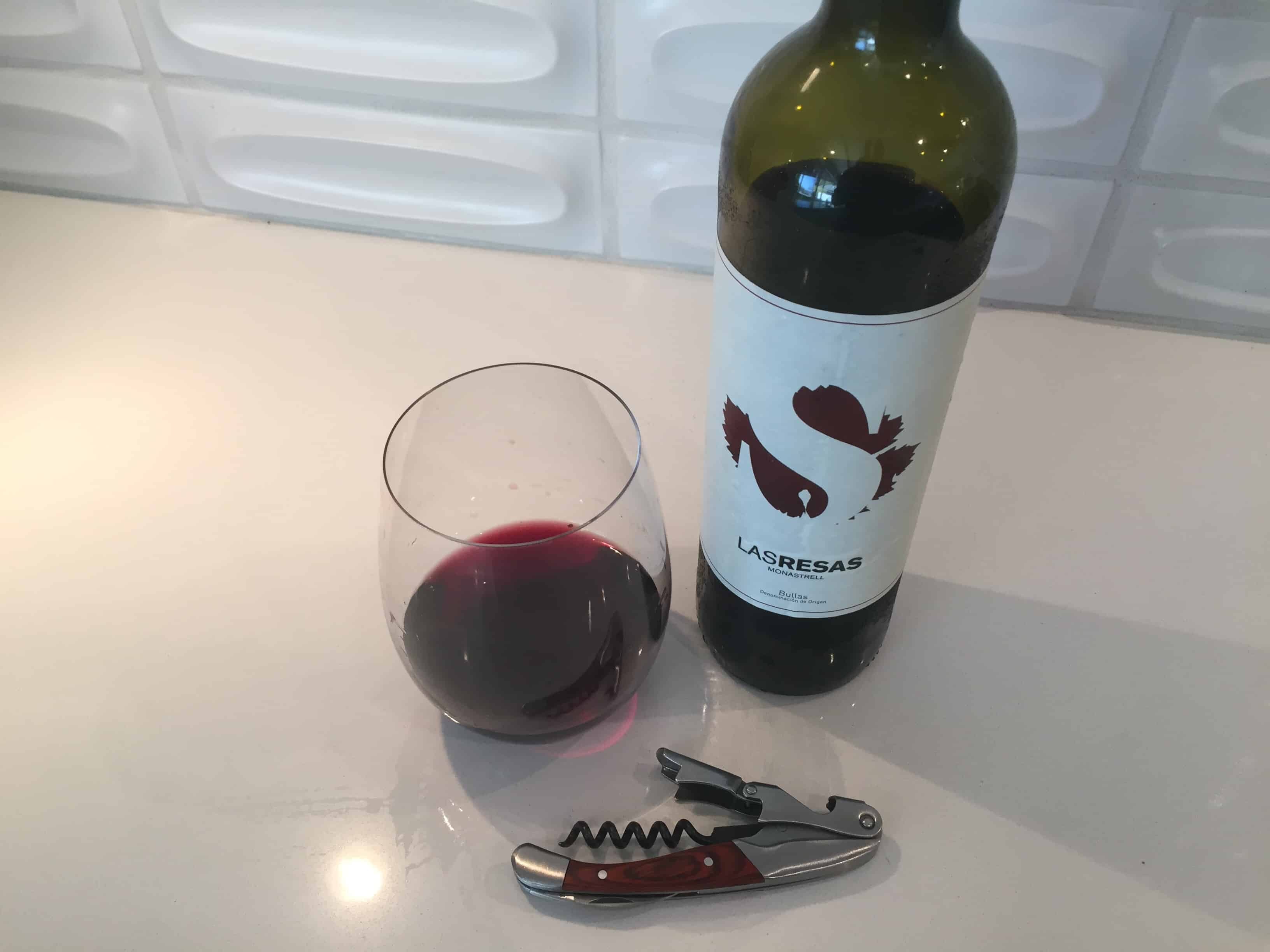 Bottle and glass of Las Resas 2017 Monastrell from Trader Joe's