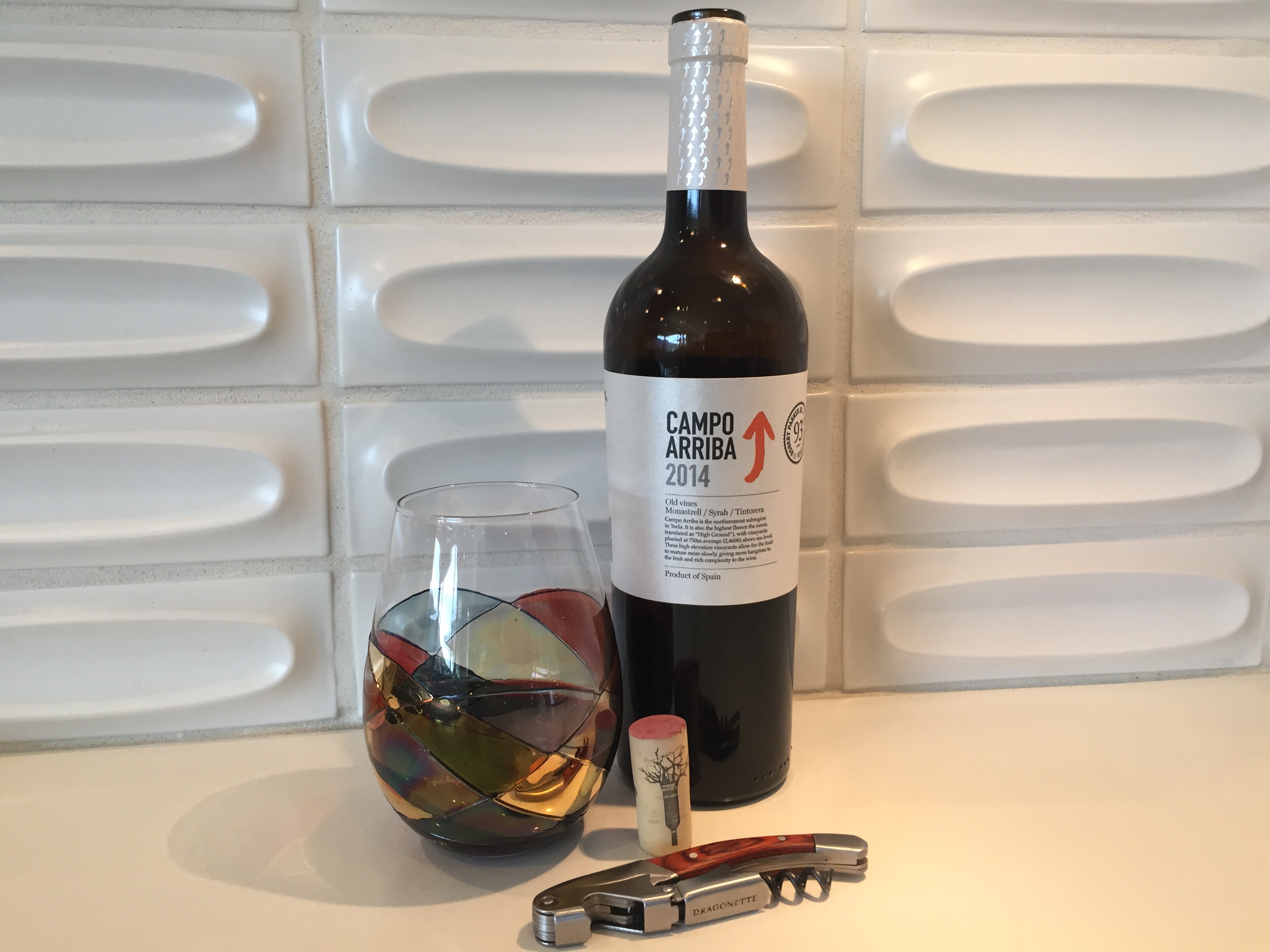 Glass and bottle of Campo Arriba 2014 red wine from Costco