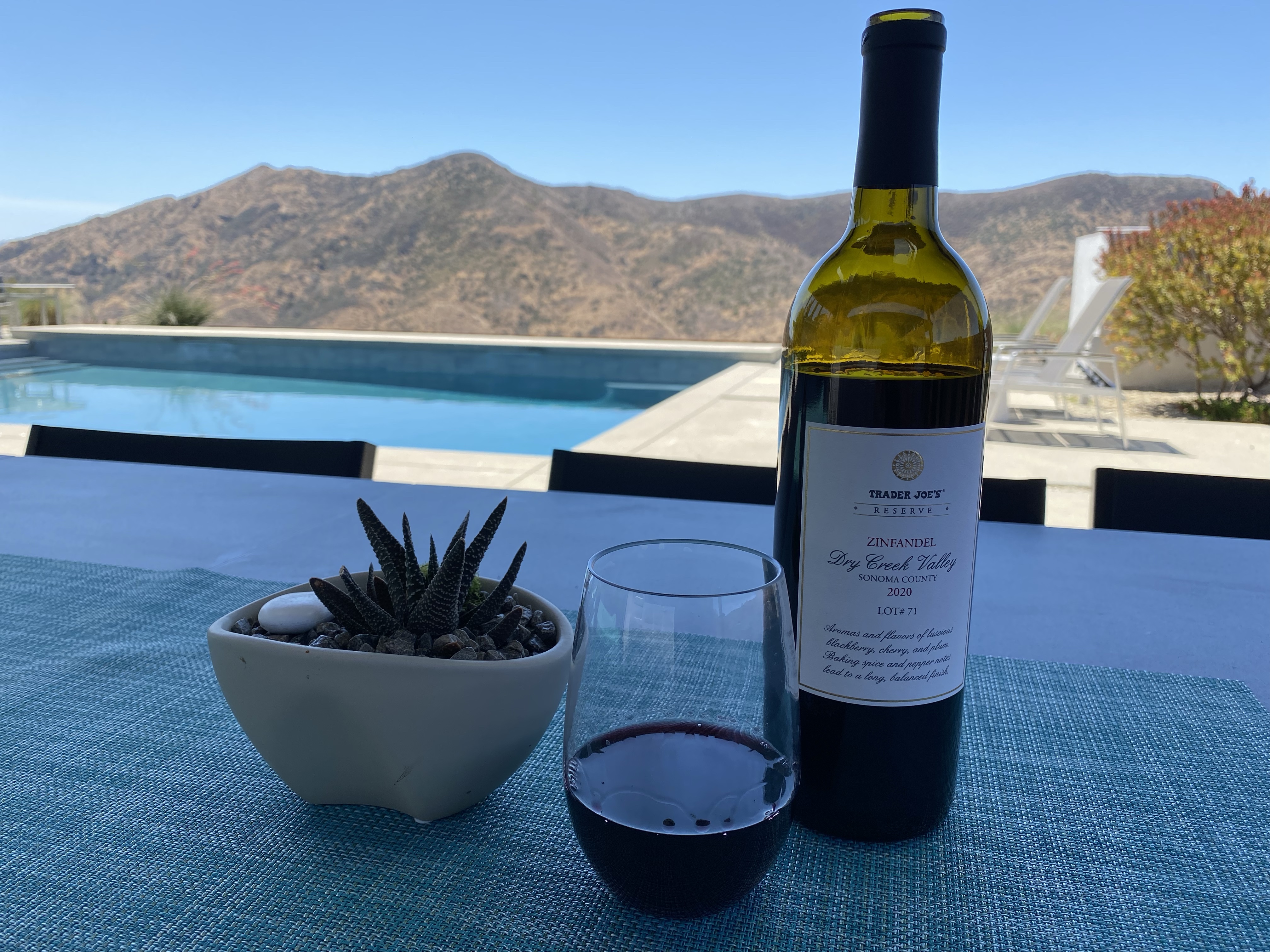 Bottle and glass of Trader Joe's Reserve 2020 Dry Creek Valley Sonoma County Zinfandel