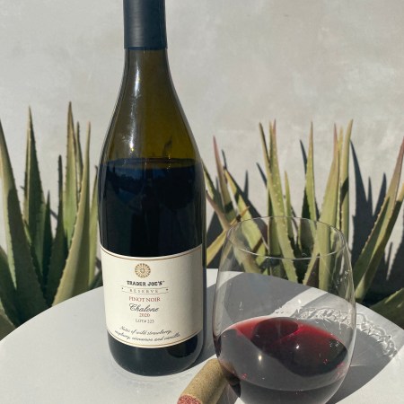 Bottle and glass of Trader Joe's Reserve 2020 Chalone Pinot Noir