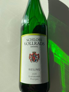Bottle of2020 Schloss Vollrads Estate Riesling in the low light of autumn