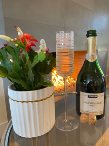 Bottle and glass of the Kirkland Signature Champagne Brut.
