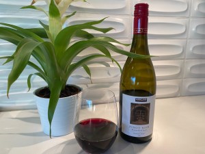 Bottle and glass of the 2021 Kirkland Signature Pinot Noir, from Russian River Valley, Sonoma County