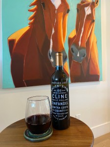 Bottle and glass of 2021 Cline Ancient Vines Zinfandel, Contra Costa County, California.