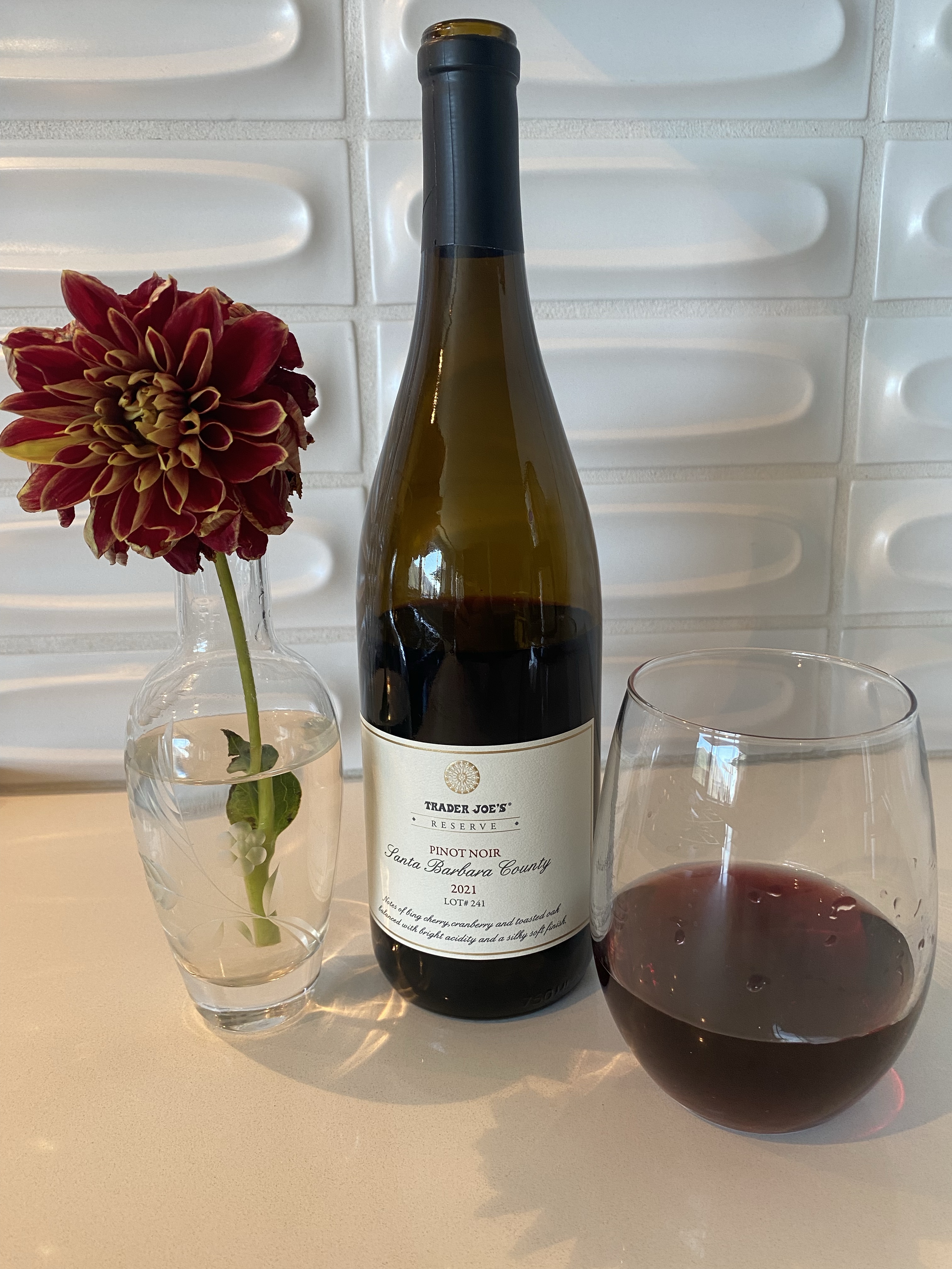 Bottle and glass of the 2021 Pinot Noir, Trader Joe's Reserve Lot #241, Santa Barbara County, California