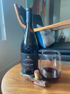 Bottle and glass of 2021  Trader Joe's Grand Reserve, Pinot Noir, Russian River Valley