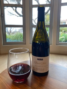 Bottle and glass of 2021 Kirkland Signature Pinot Noir,  Willamette Valley, Oregon
