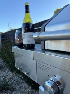 Bottle and glass of the 2021 Torbreck "Woodcutter's" Shiraz, Barossa Valley, Australia 