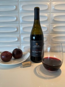 Bottle and glass of the 2022 Trader Joe's Grand Reserve Lot #132, GSM