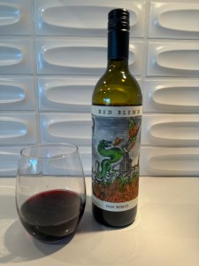 Bottle and glass of the 2020 Rabble Red Blend from Costco.