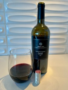 Bottle and glass of 2022 Trader Joe's Diamond Reserve Cabernet Sauvignon, Oakville