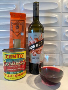 Bottle and glass of the 2019 Borreo Sangiovese, San Marzano tomatoes, and Italian pasta. Dinner!