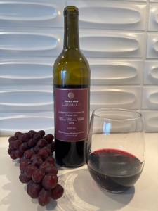 Bottle and glass of 2022 Trader Joe's Reserve, Lot #261, Cab/Syrah, Horse Heaven Hills