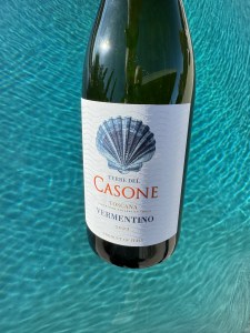 The front label of Casone Vermentino suspended over a swimming pool