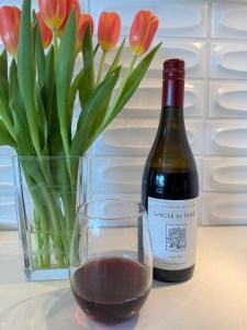 Bottle and glass of the 2023 Valle de Inez Pinot Noir