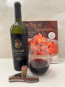 Bottle and glass of the 2023 Terre del Casone Toscana, with some food pairing suggestions!